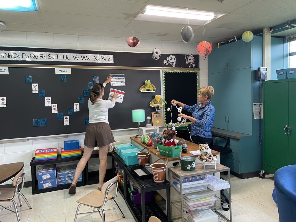 Ms. Buren and Ms. Van Anrooy setting up a classroom for the new school year 