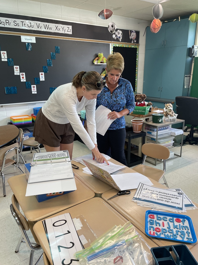 Ms. Buren and Ms. Van Anrooy setting up a classroom for the new school year 