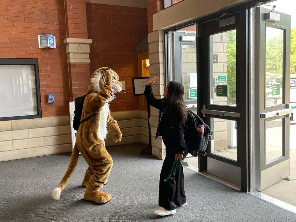 Wiley highfiving a new teacher 