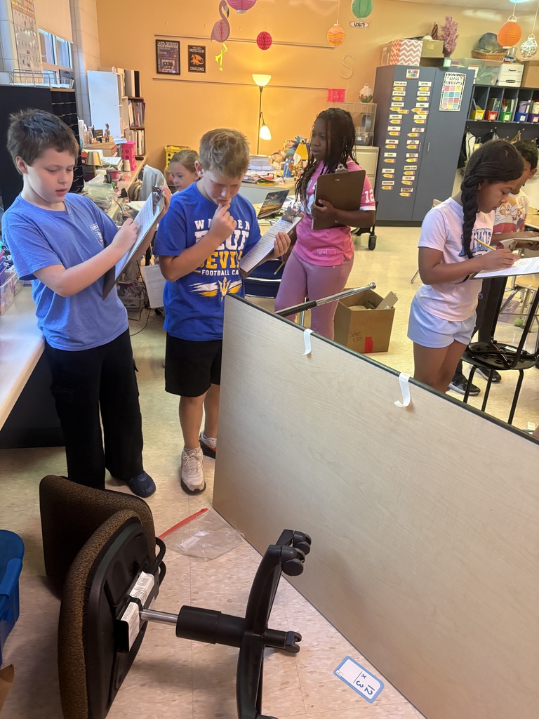 Students survey the evidence with clipboards and jotting down observations