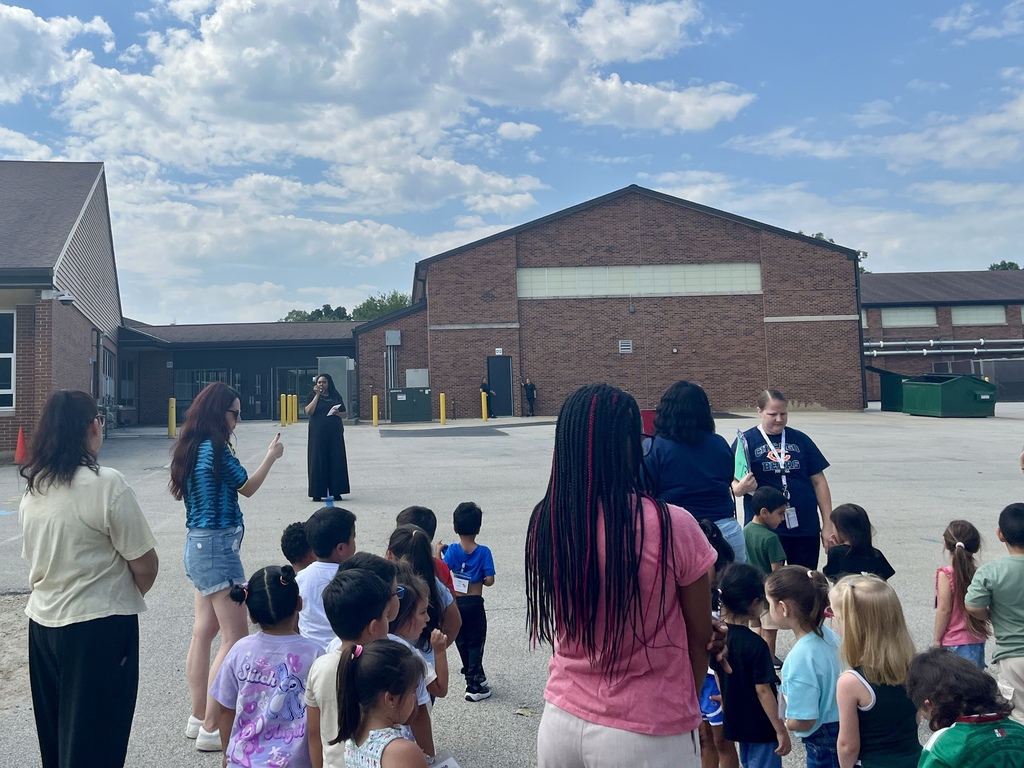 Students wait outside during a fire drill