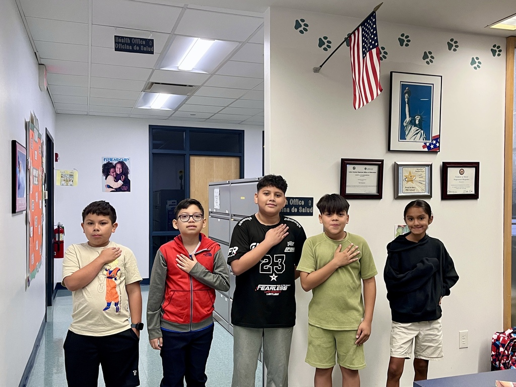 Students lead the Pledge of Allegiance during morning announcements