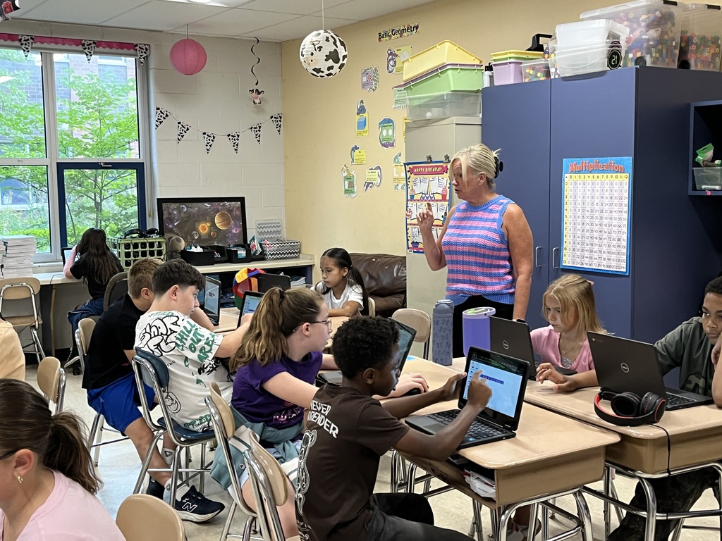 Converting improper fractions to mixed numbers during Math in Ms. McCowen's class! 