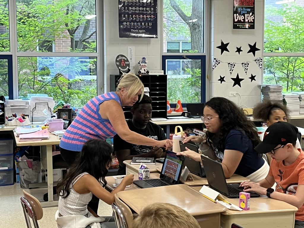 Converting improper fractions to mixed numbers during Math in Ms. McCowen's class! 