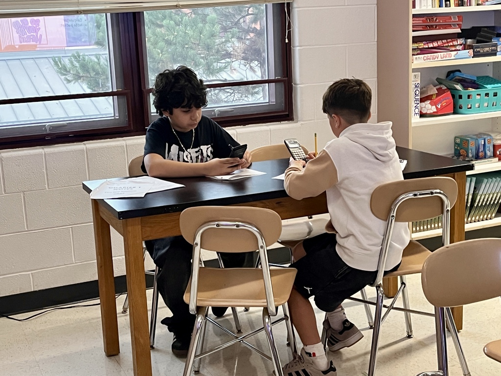 7th Grade Challenge Math students work in groups to prepare for a test in Ms. Olekszy's class