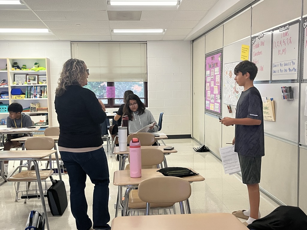 7th Grade Challenge Math students work in groups to prepare for a test in Ms. Olekszy's class