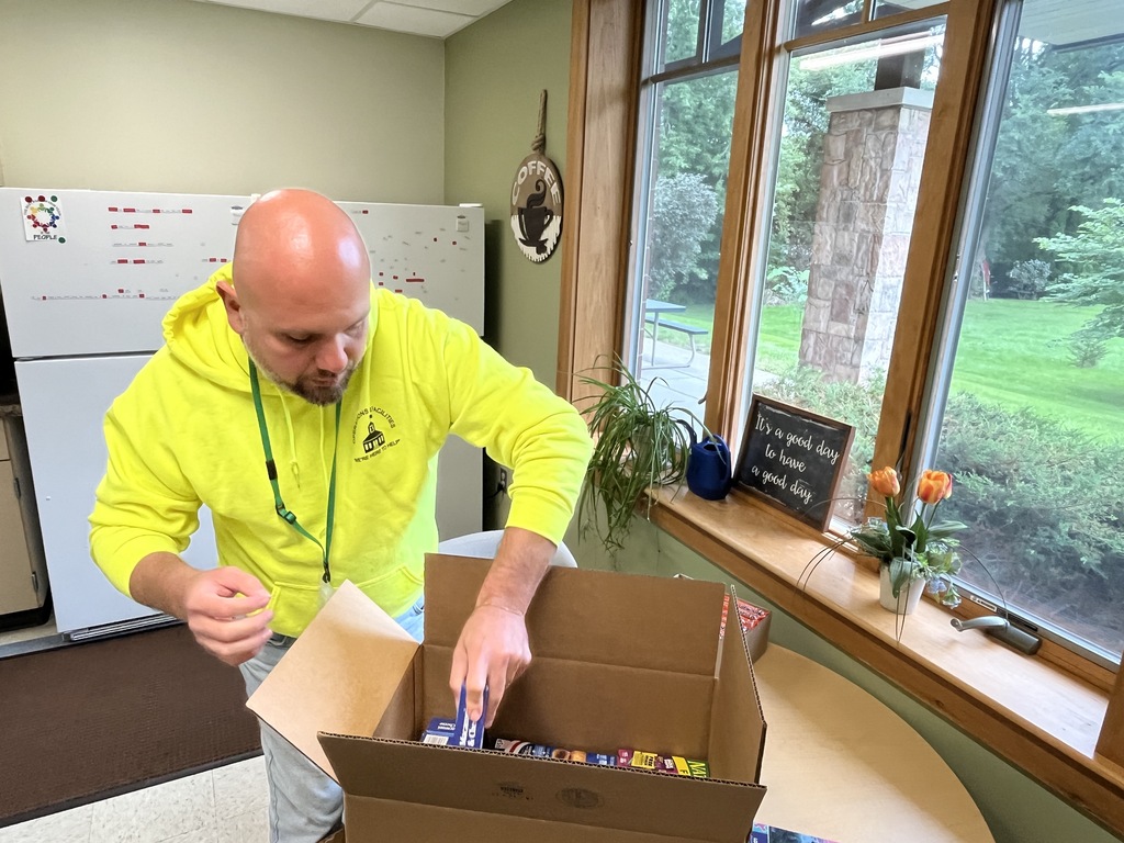 The district office team packing donations during District Day of Service, Sept. 2026