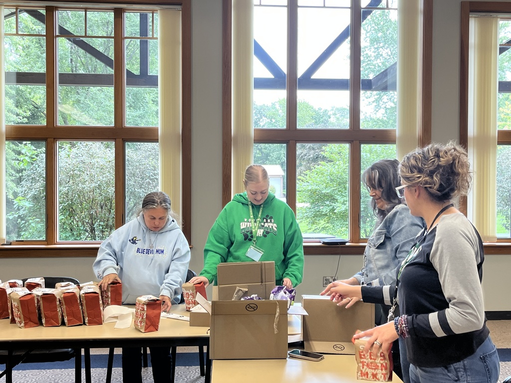 The district office team packing donations during District Day of Service, Sept. 2026
