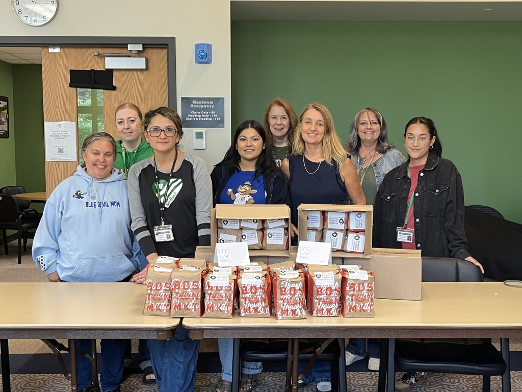 The district office team packing donations during District Day of Service, Sept. 2026