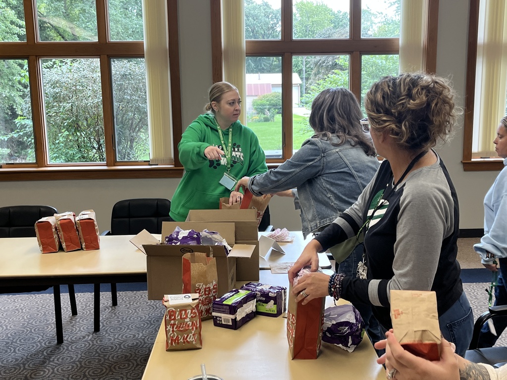 The district office team packing donations during District Day of Service, Sept. 2026