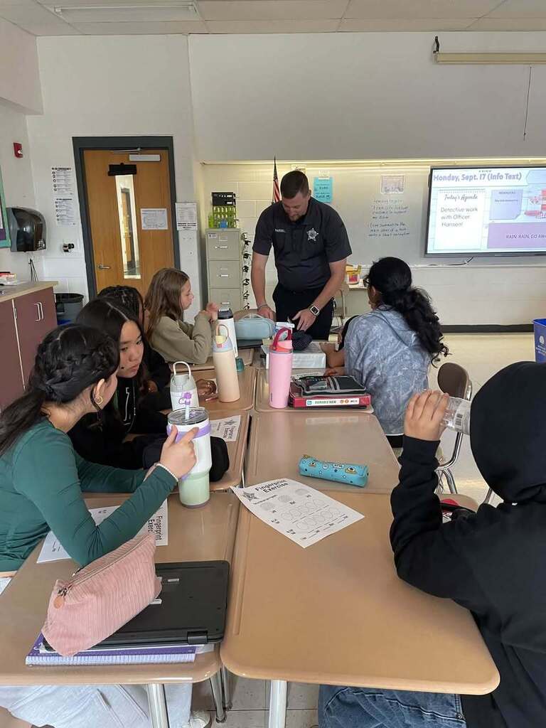 Students in Ms. Wakefield's class working the Dets. Hansen and Parsell