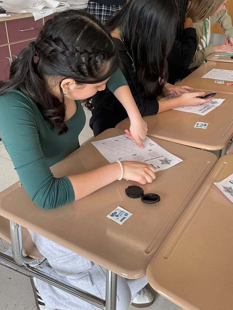 Students in Ms. Wakefield's class working the Dets. Hansen and Parsell