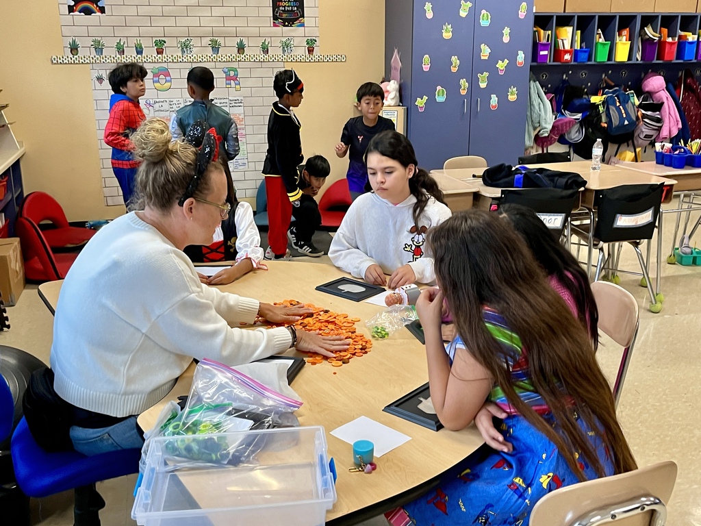 Students doing a craft at Fall Fest