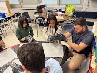 students molding pretzel dough