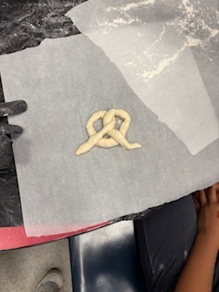 Pretzel dough on parchment paper