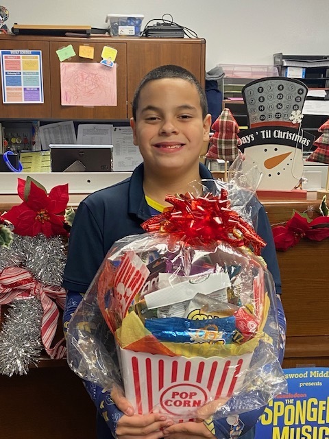 Student holding an award basket