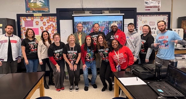 Teachers wearing their 6 7 shirts