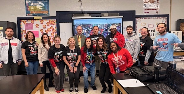 Teachers wearing their 6 7 shirts