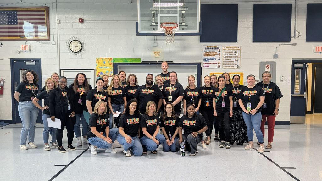 school staff wearing same t shirt about autism awareness