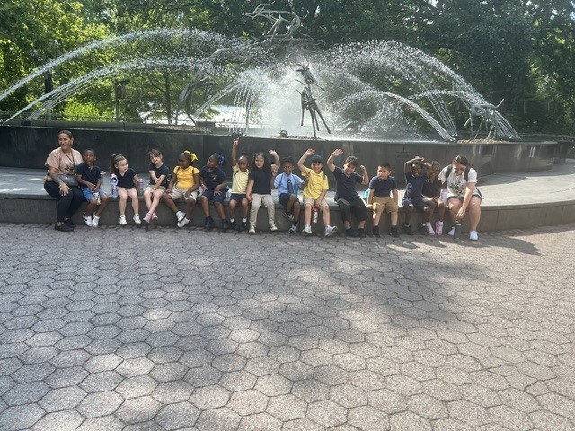 Students by the fountain at the zoo