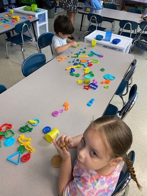 Student with playdoh