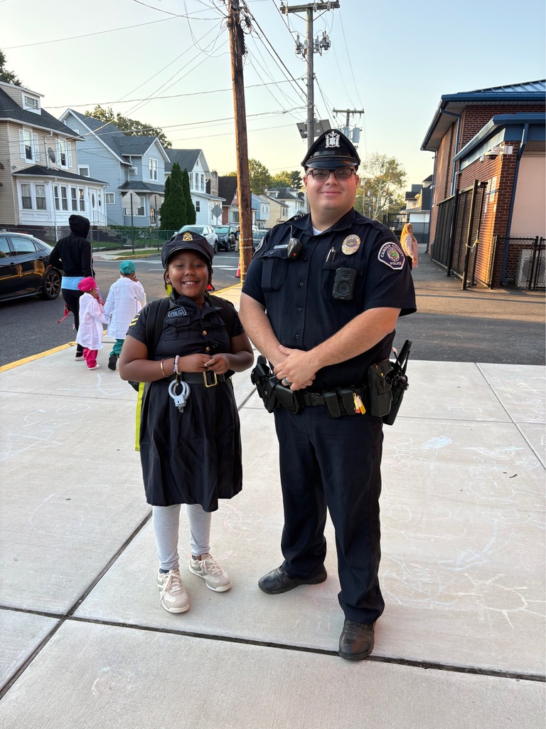 student dressed as police officer next to a police officer