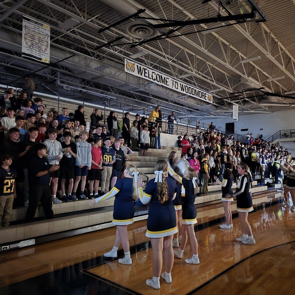 Cheerleaders leading the students in cheers