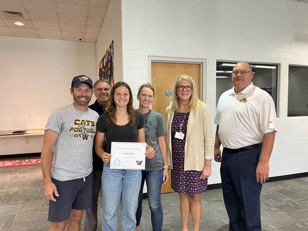 Senior of the Month (September 2025) Camille Strong pictured with Woodmore Admin and parents at the September Board Meeting