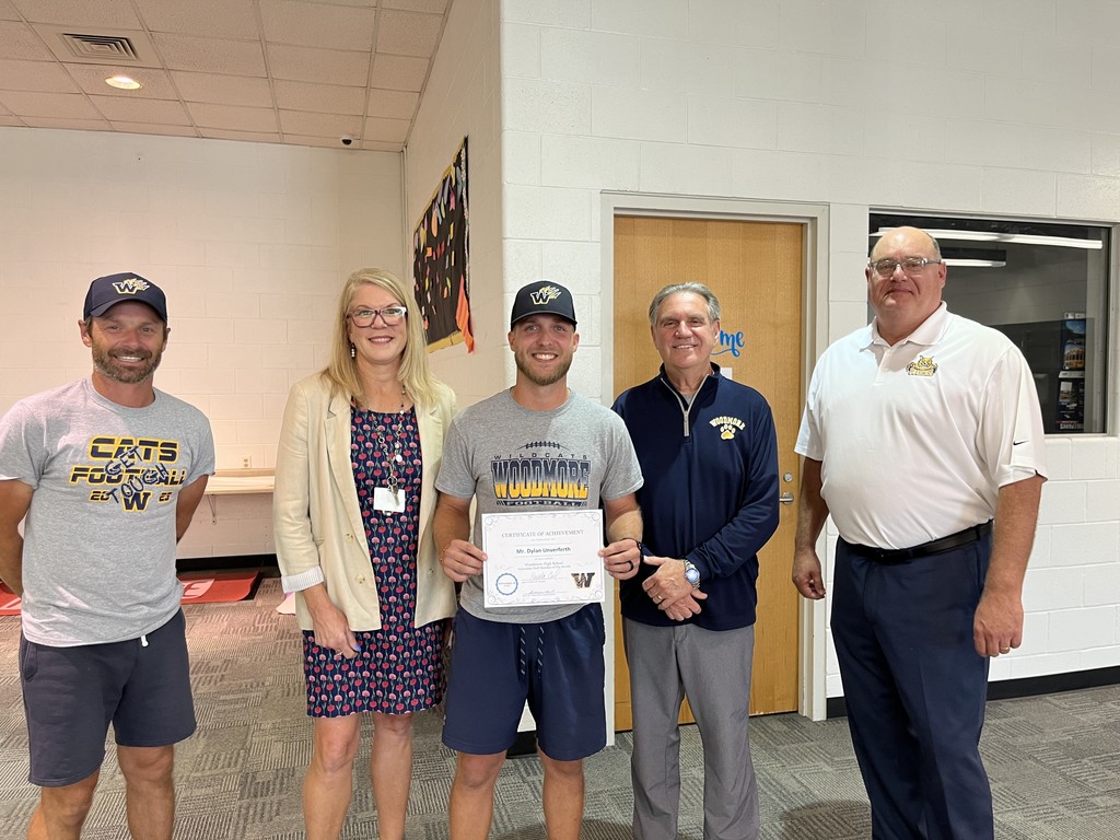 High School Teacher of the Month (September 2025) Mr. Dylan Unverferth pictured with Woodmore Admin at the September Board Meeting