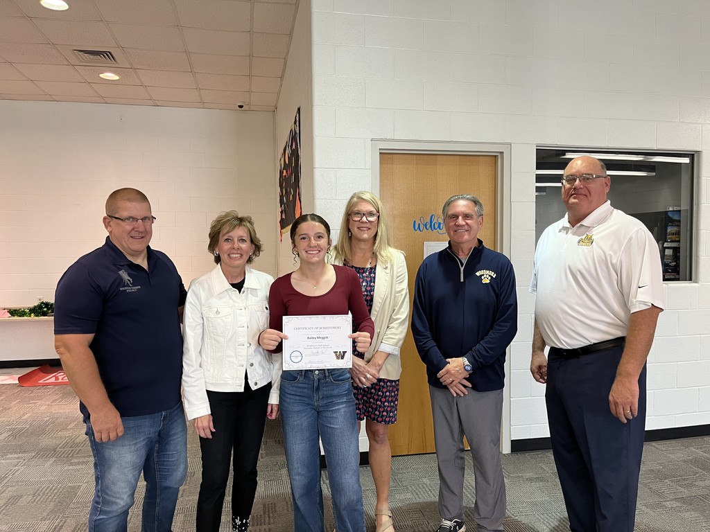 High School Student of the Month (September 2025) Bailey Meggitt pictured with Woodmore Admin and parents at the September Board Meeting