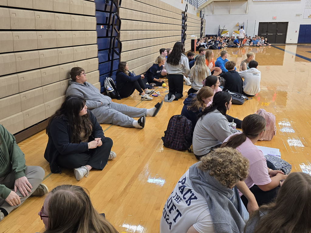 Seniors waiting in their corner of the gym for the next item needed in the Scavenger Hunt