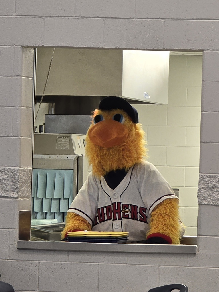 Muddy waiting to collect the dirty trays from students at lunch.