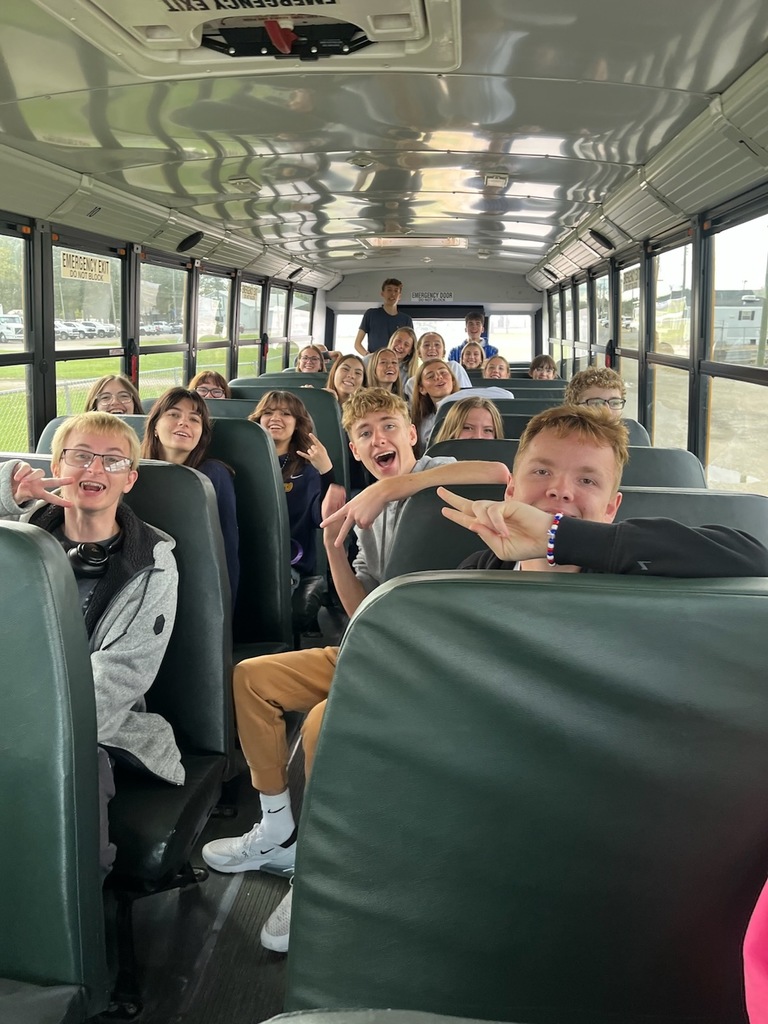 Students on the bus heading to the Ottawa County Career Showcase, posing for a picture