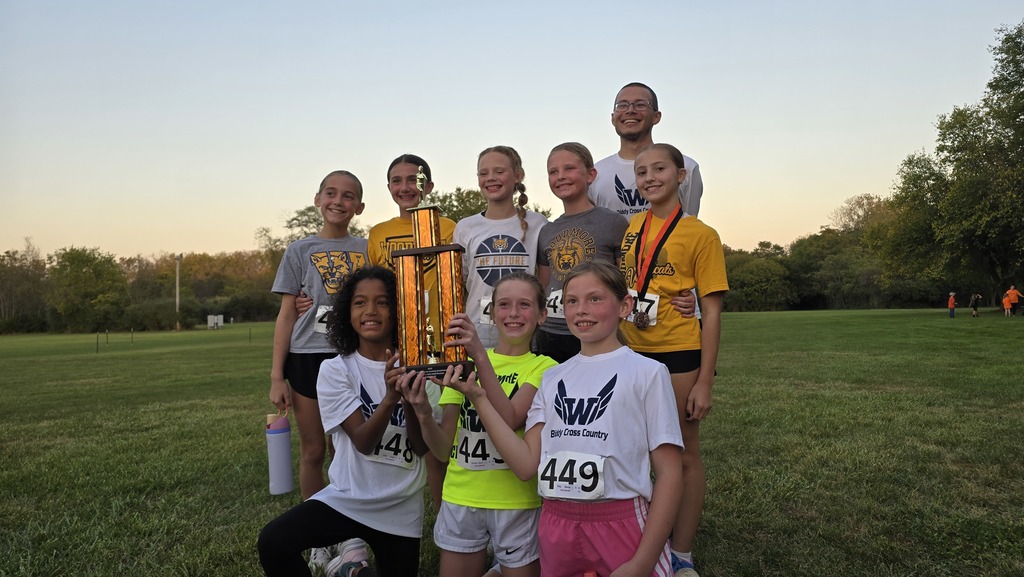 The second place girls 4th-6th team posing with their trophy and Mr. Kigar.