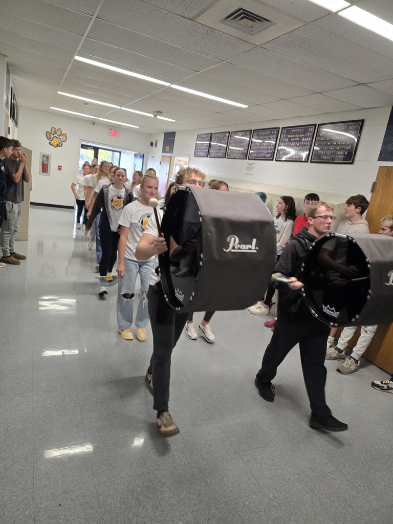 The final members of the drumline are followed by the soccer team