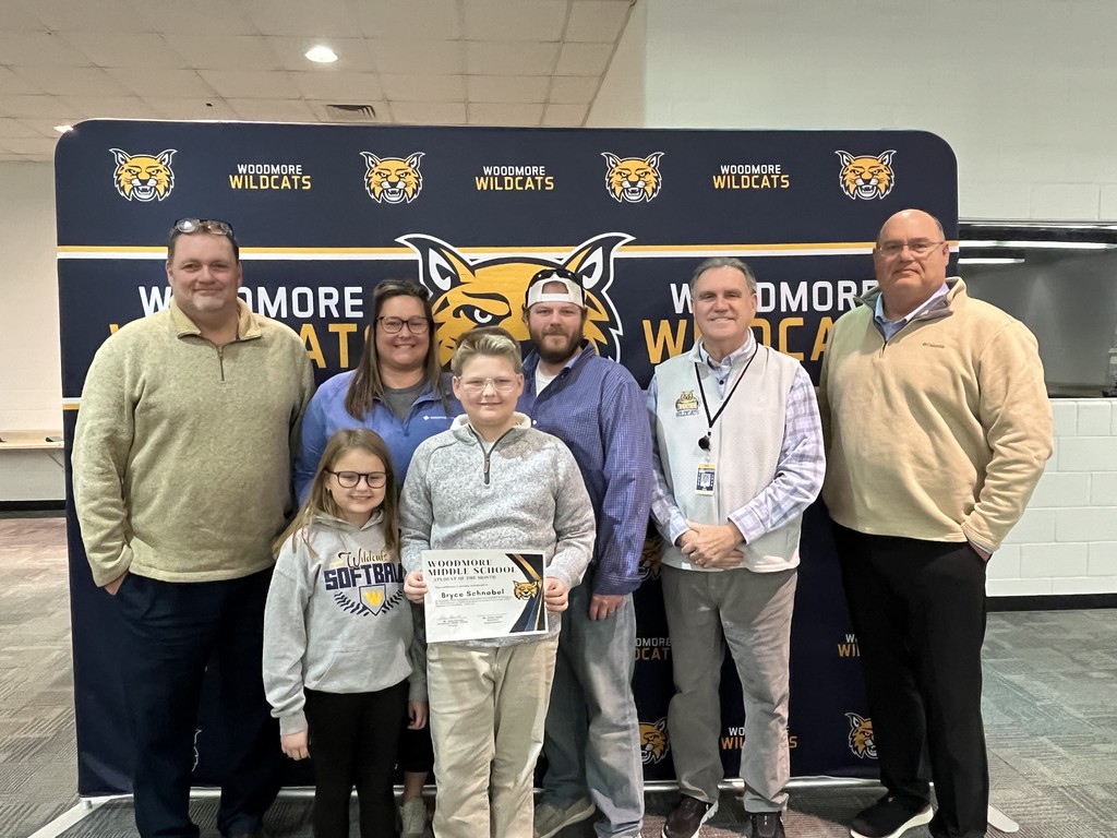 Mr. Barrett, family of Bryce Schnabel, Bryce Schnabel, Mr. Mock, and Board President Mr. Andy Miller.