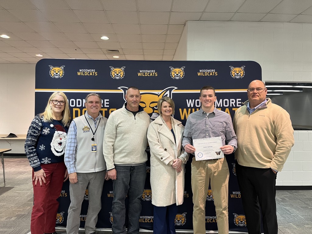 Mrs. Coil, Mr. Mock, family of Calvin Lipstraw, Calvin Lipstraw, and Board President Mr. Andy Miller.