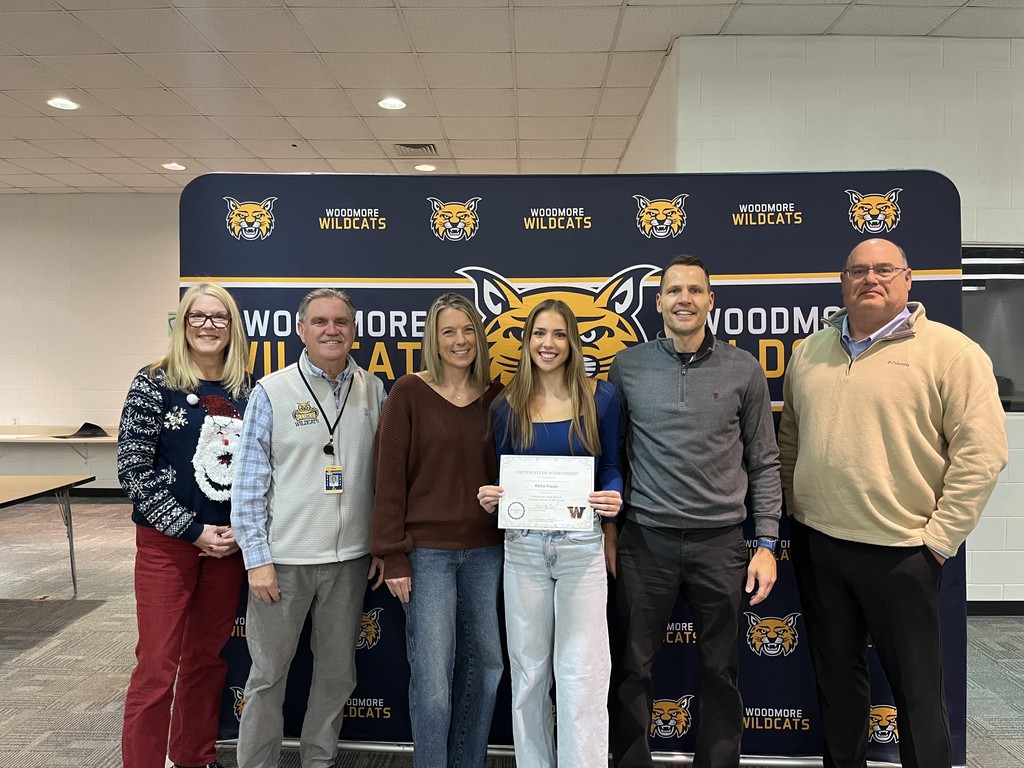 Mrs. Coil, Mr. Mock, family of Keira Travis, Keira Travis, and Board President Mr. Andy Miller.