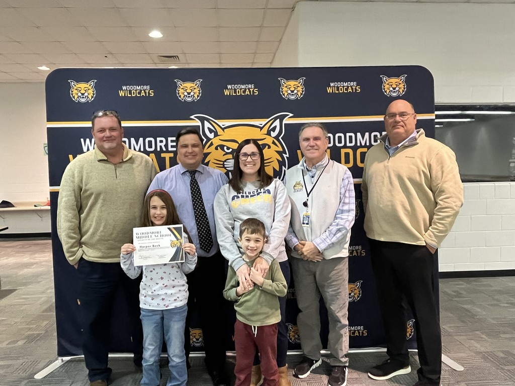 Mr. Barrett, Harper Beck, family of Harper Beck, Mr. Mock, and Board President Mr. Andy Miller.