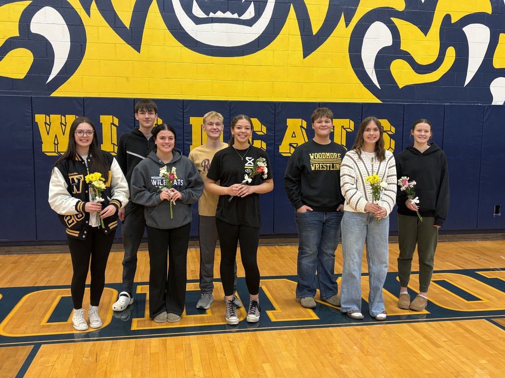 Our Winter Royalty Court poses for a picture in the gym. The girls are holding flowers - unfortunately, a number of students were absent today, so not everyone is pictured.