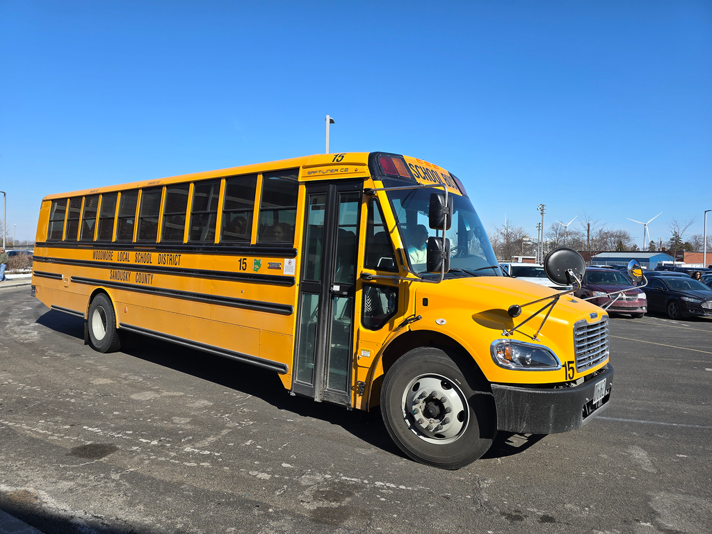 The second bus arrives back on campus. You can see the doors as it's turning past the camera.