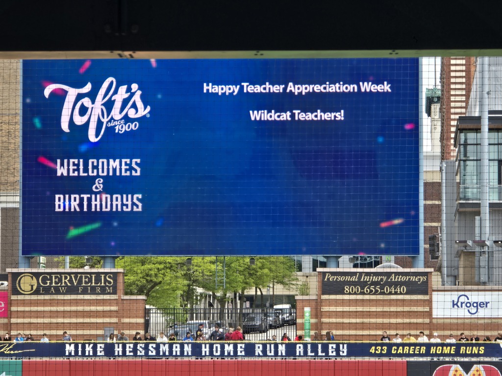 The picture is of the jumbotron. It is blue and has a message reading "Happy Teacher Appreciation Week Wildcat Teachers!"