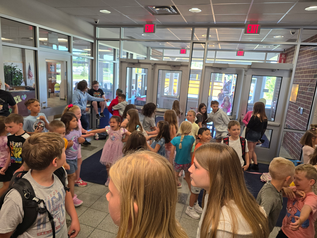 Elementary students dance in the front lobby during the last dance party.