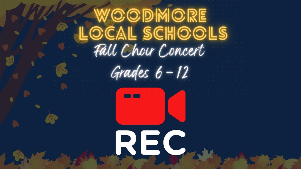 Graphic against a navy blue background featuring an autumn tree on the left blowing leaves and a bed of fallen leaves along the bottom. In the center, yellow glowing neon-style text reads "WOODMORE LOCAL SCHOOLS". Below it, white cursive script reads "Fall Choir Concert Grades 6–12". At the bottom center, there is a large red video camera graphic above the white capital letters "REC".