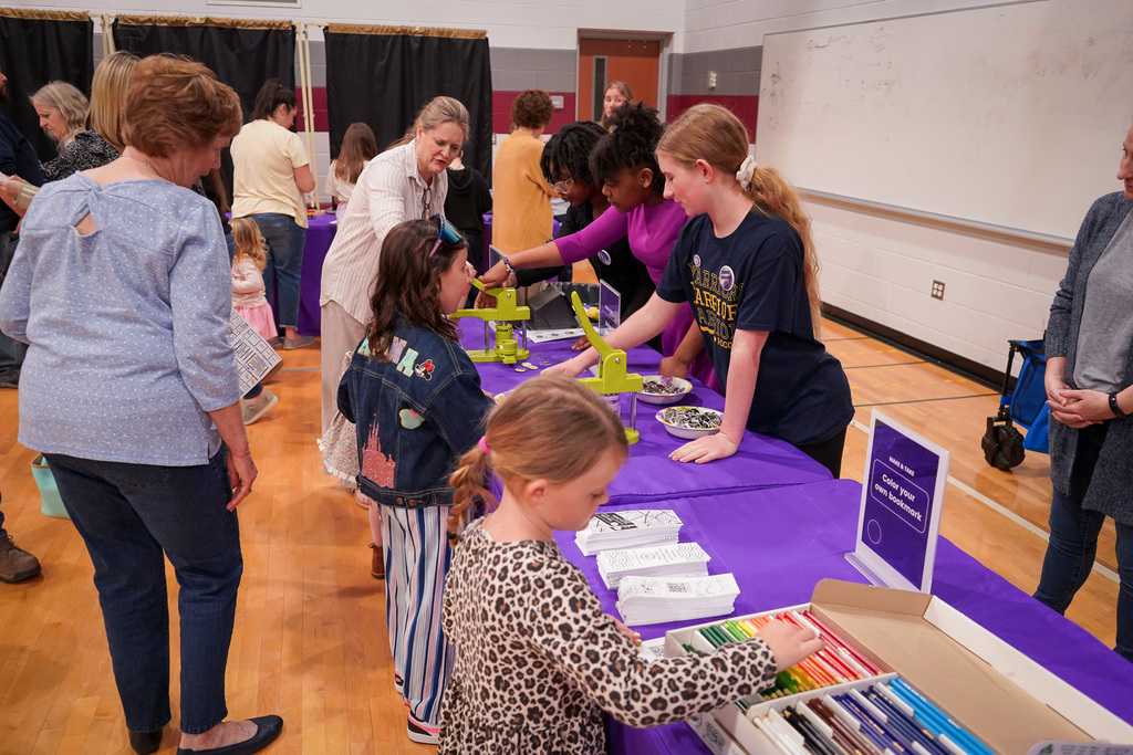 students at a button making activity