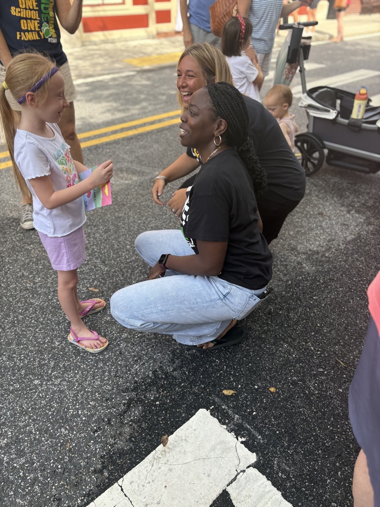 Dr. Jackson and Mrs. Miller with a student