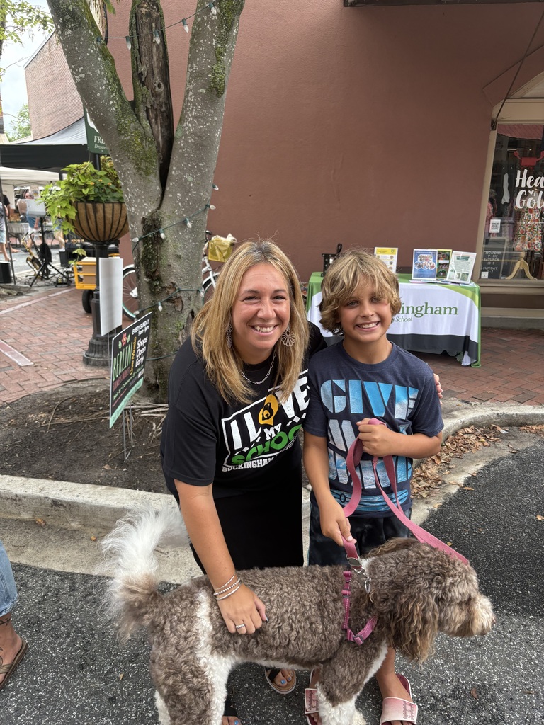Mrs. Miller with a student and their dog