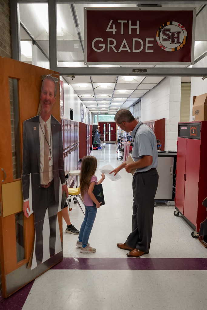 Student and teacher in hallway
