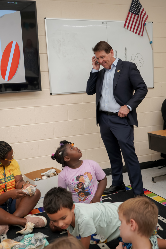 Man and students in classroom
