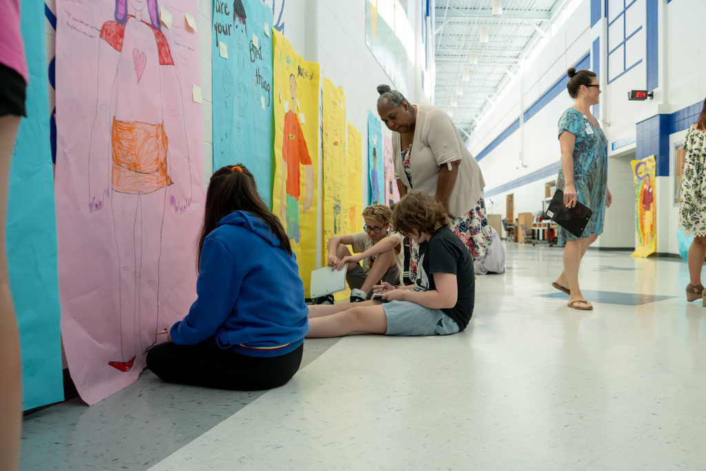 Students working in a hallway